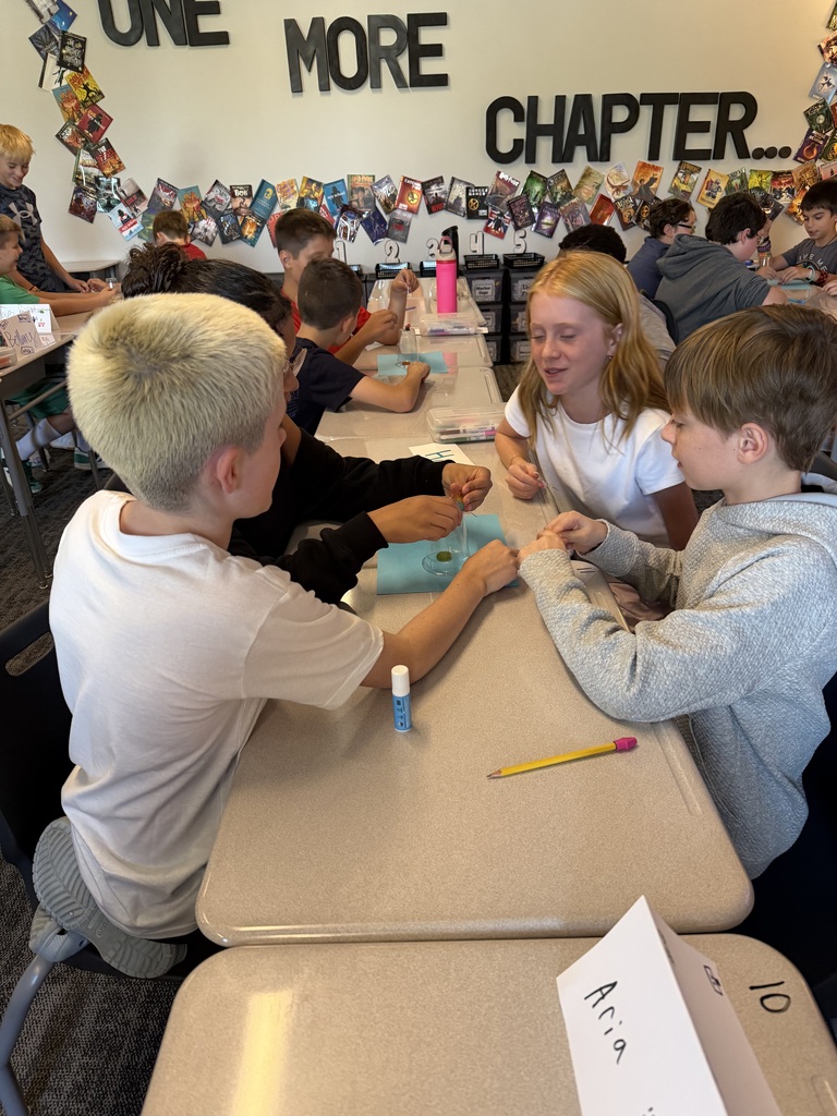 A group of student working at tables. 