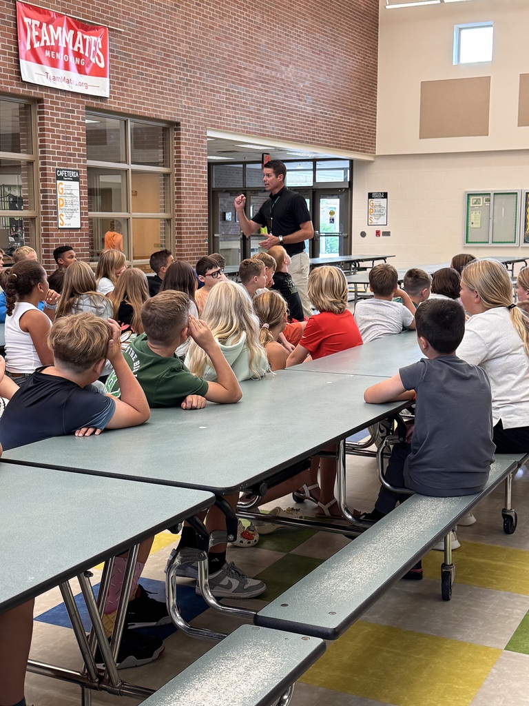 Mr. Basye the principal reviewing expectations with 5th grade students.