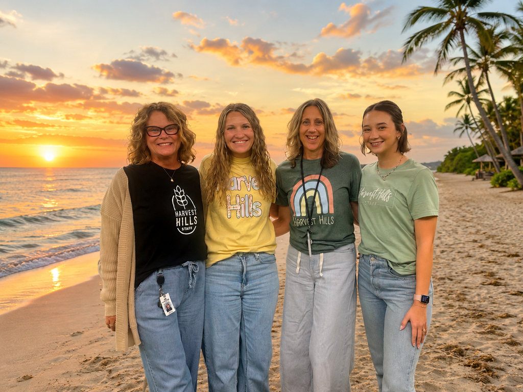 kindergarten teaching team with a beach in the background