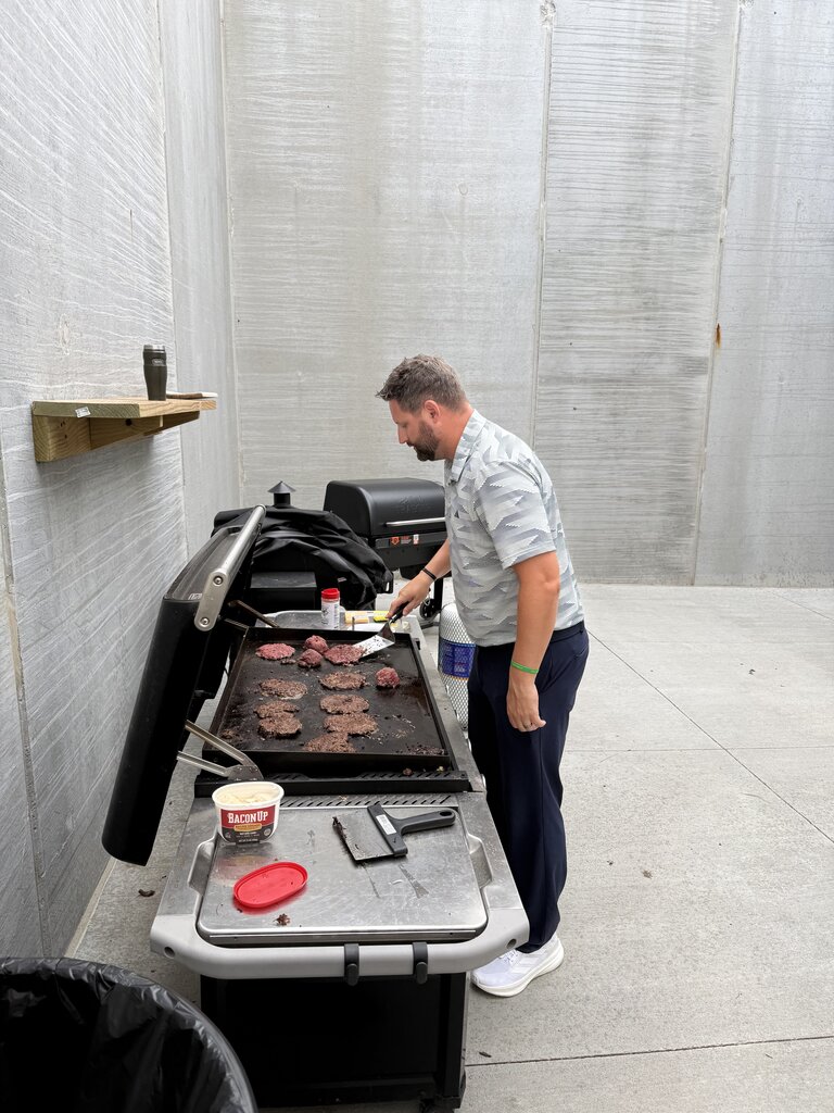 A man grilling.