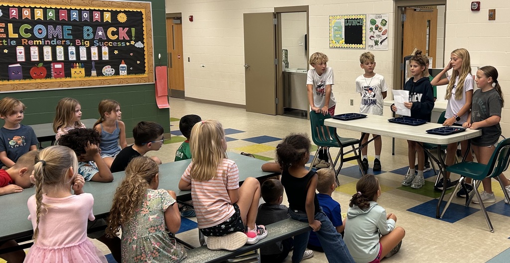 5th Grade students demonstrating positive expectations to kindergarten students.  