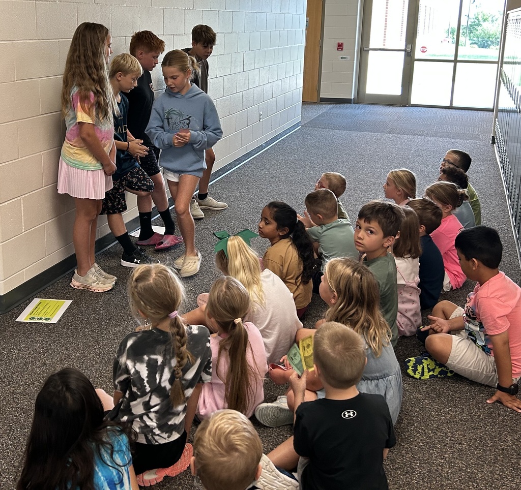 5th Grade students demonstrating positive expectations to kindergarten students.  