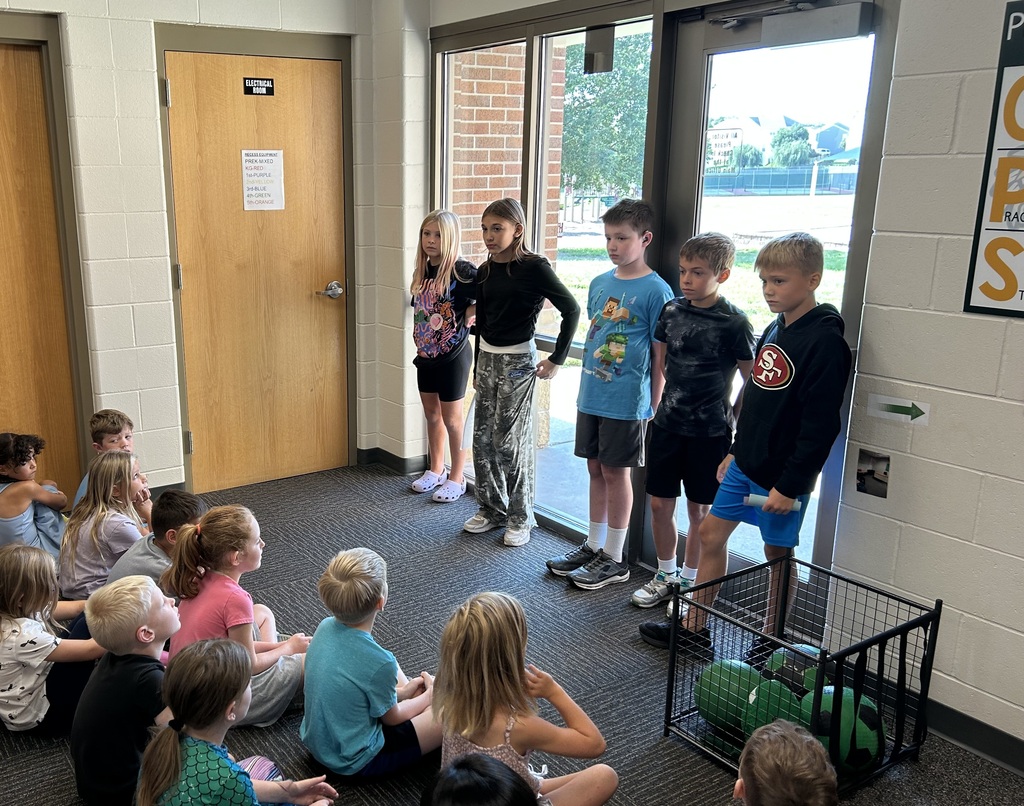 5th Grade students demonstrating positive expectations to kindergarten students.  