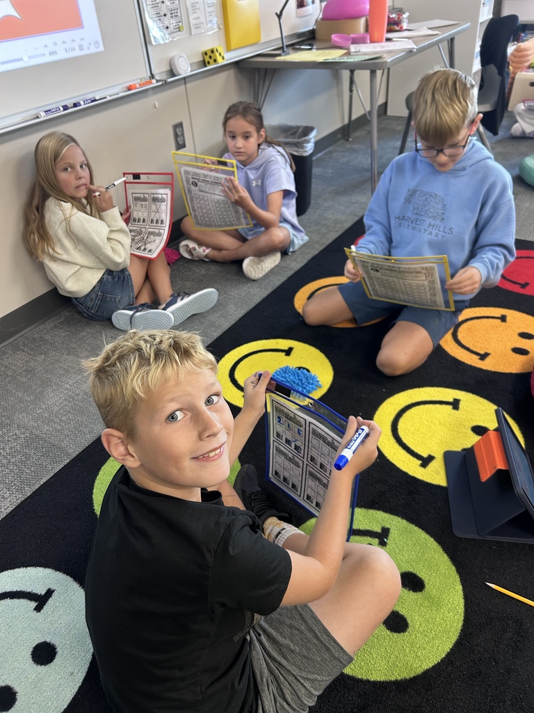 students playing curriculum battleship on a classroom floor