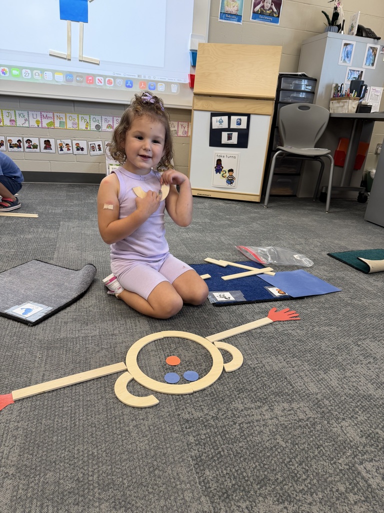 preschooler with mat man on the floor