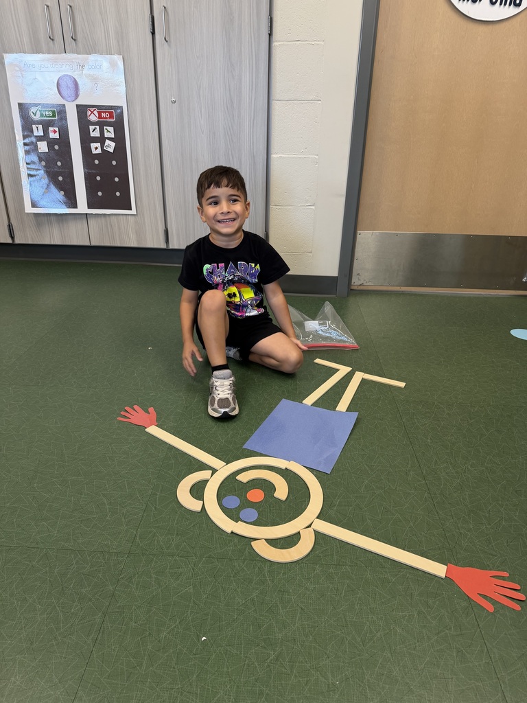 preschooler with mat man on the floor