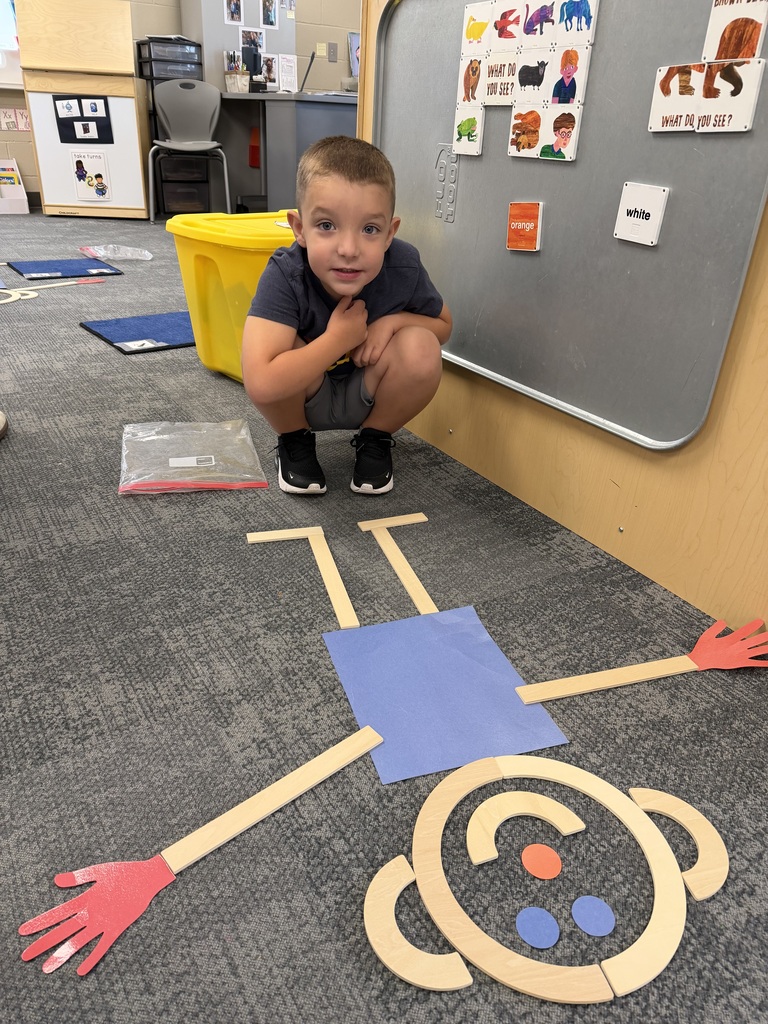 preschooler with mat man on the floor