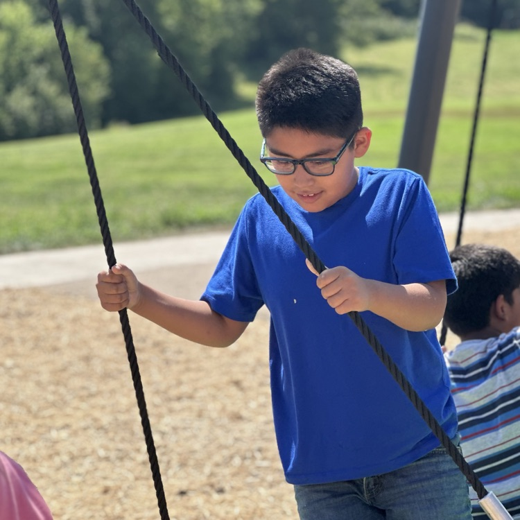 child on swing 