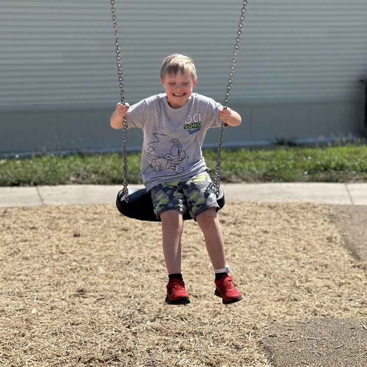 child on swing