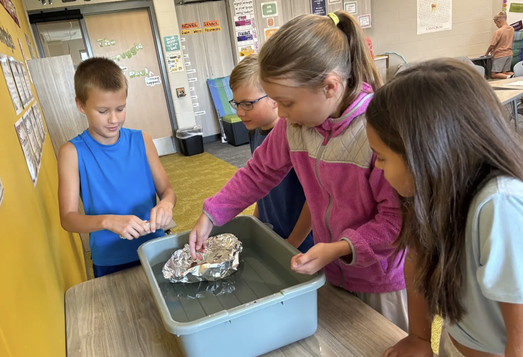 students working on floating foil