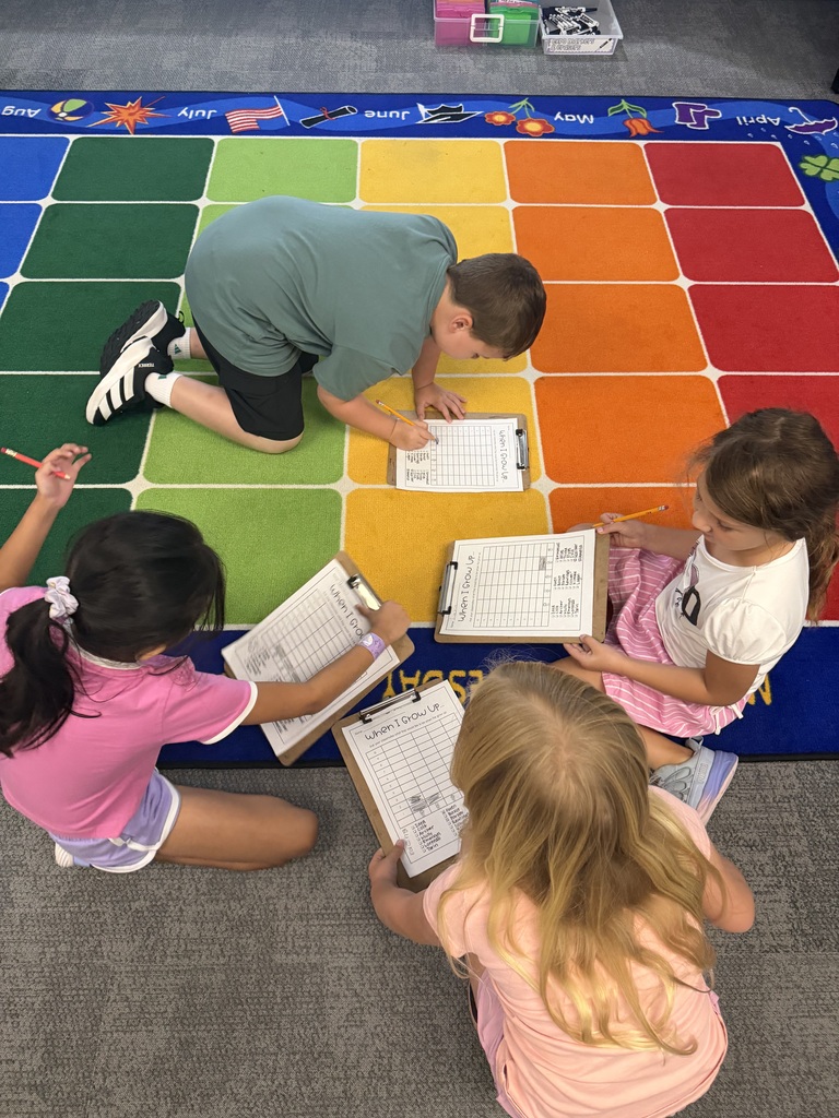 students on a survey with clipboard 