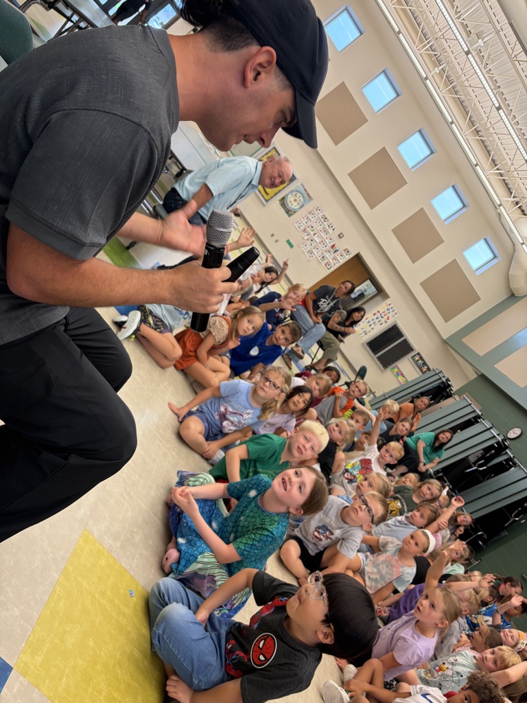 Author, Justin Colon, speaking to students about writing children's books.