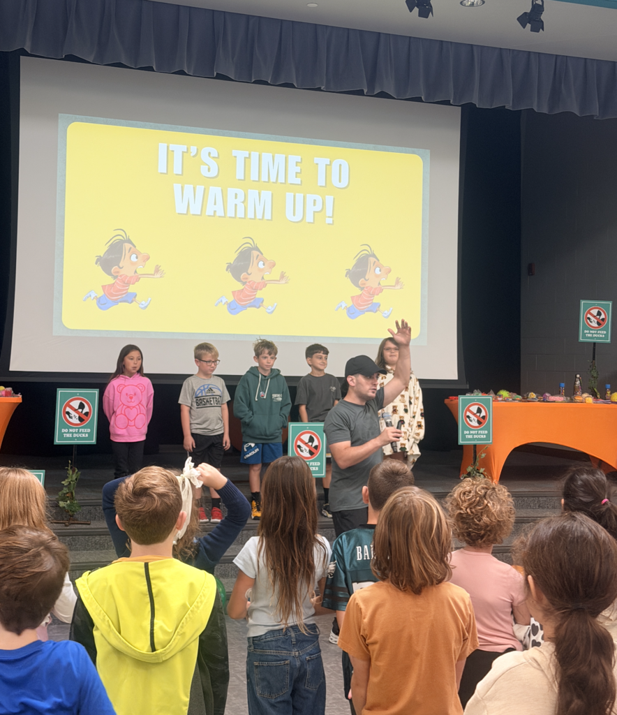 Justin leads 5 students through an acting performance of The Quacken!