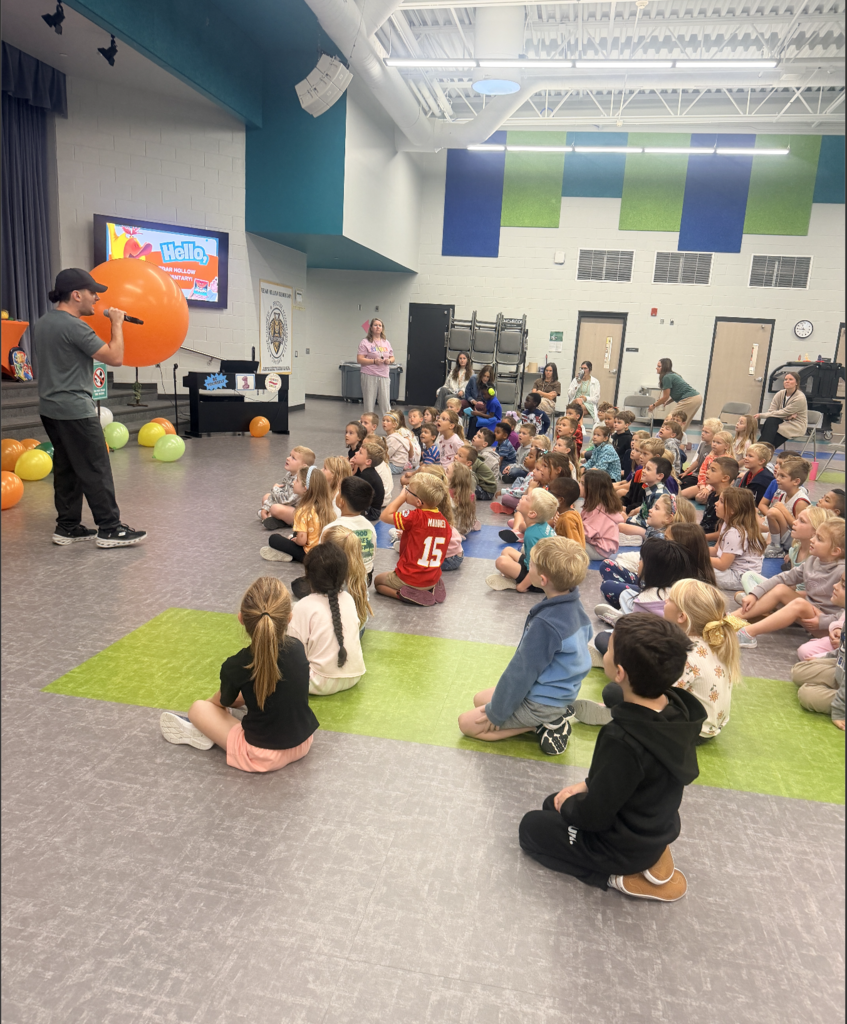Justin shares an exciting introduction to his presentation with the kindergarten and 1st grade students using a giant balloon! 