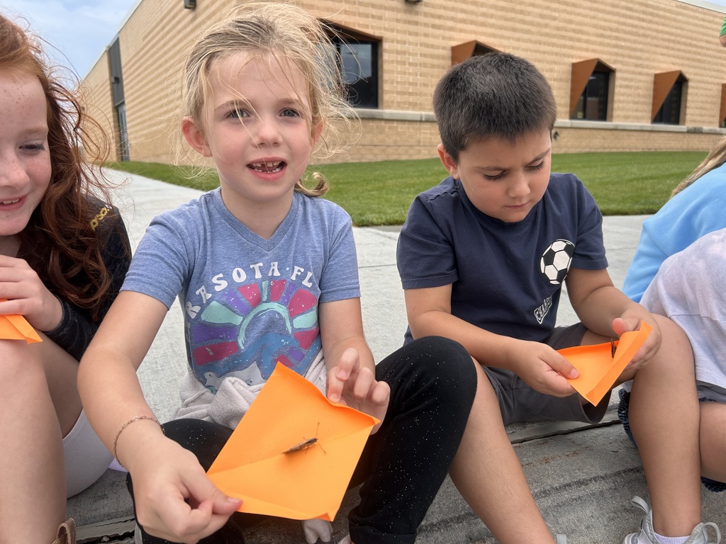 students holding butterflies for a release