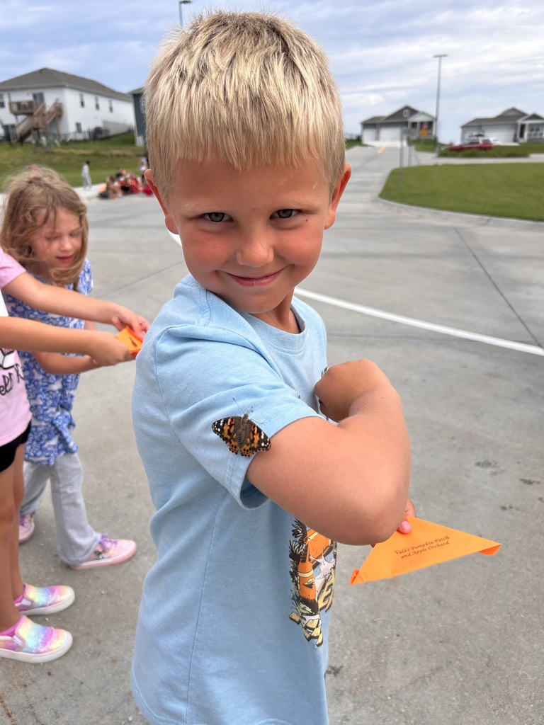 students with a butterfly on their shirt