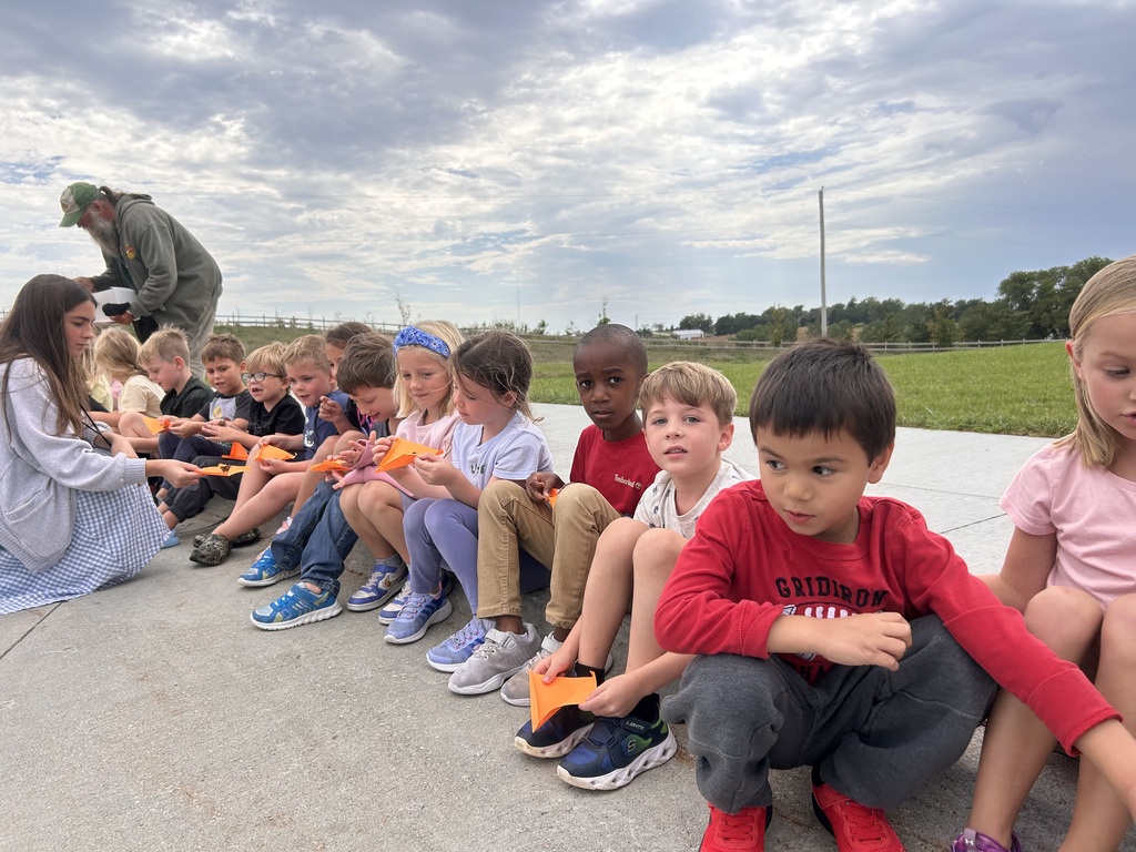 students getting ready to open butterflies for a release