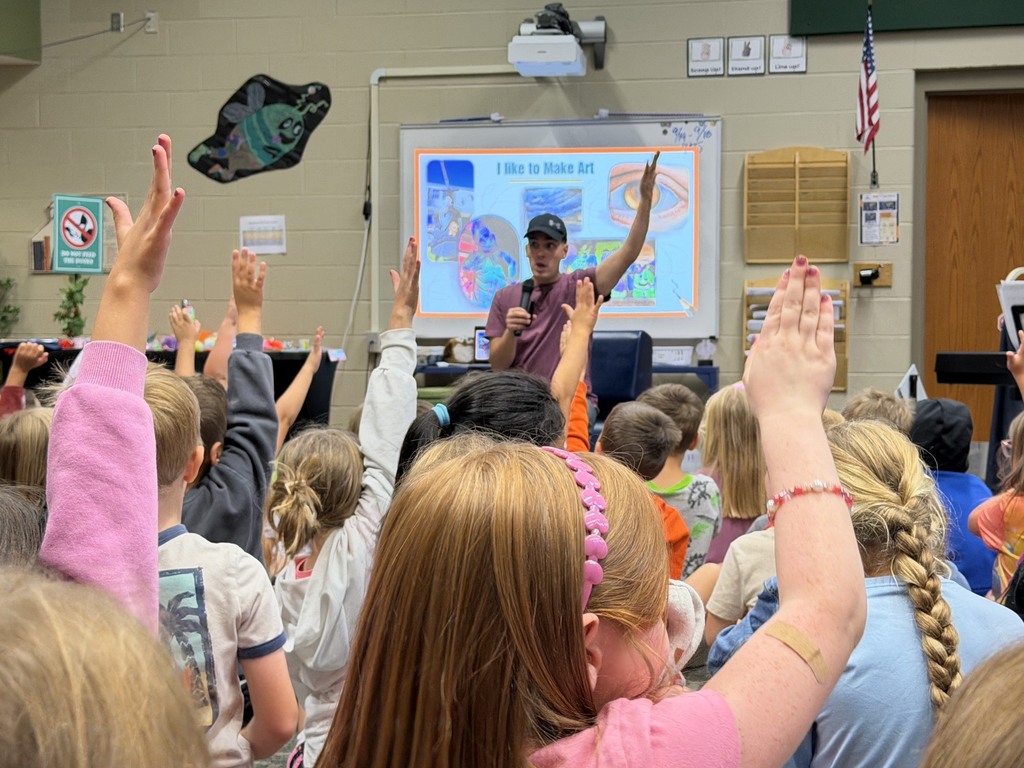 Justin Colón interacting with Kindergarten and 1st grade