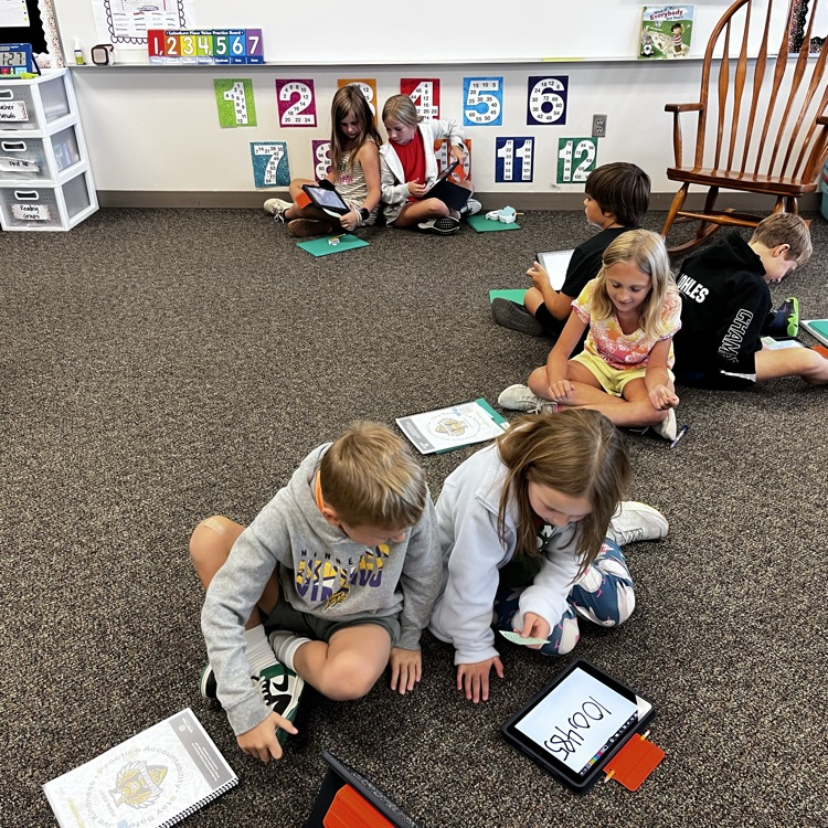 kids working in math using iPads
