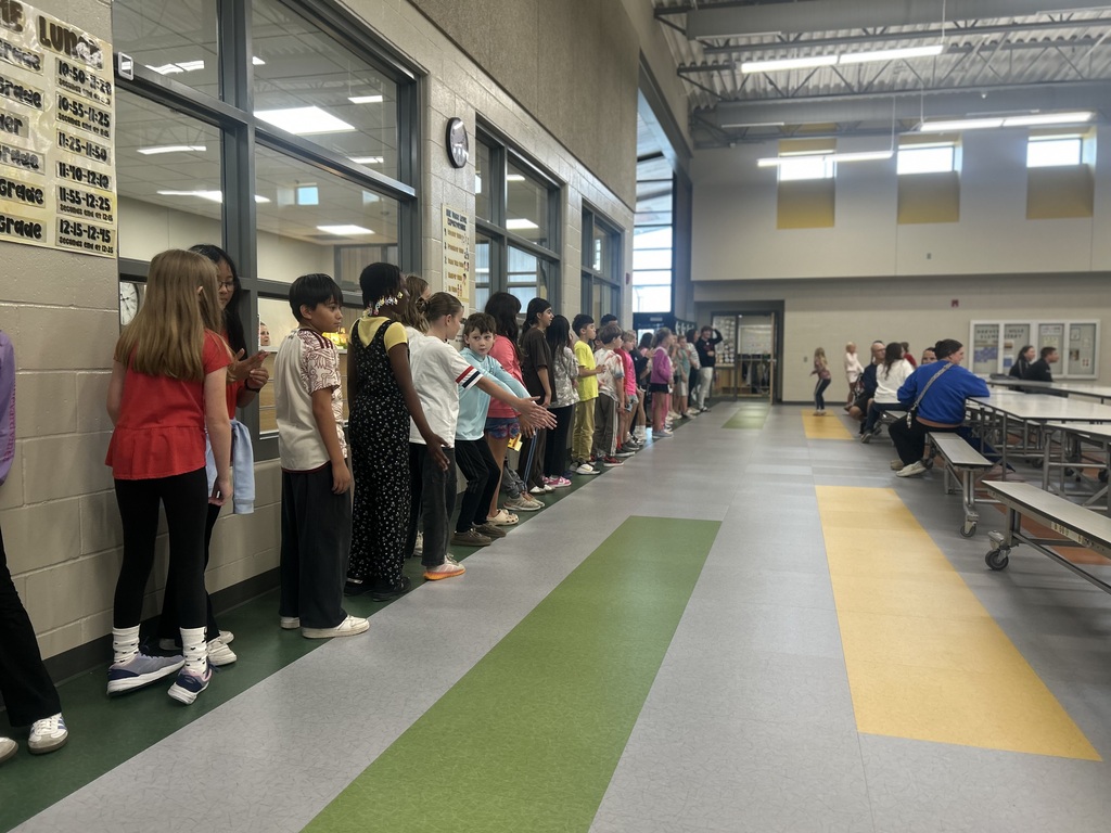 students gathered to watch the harvest run inside the gym