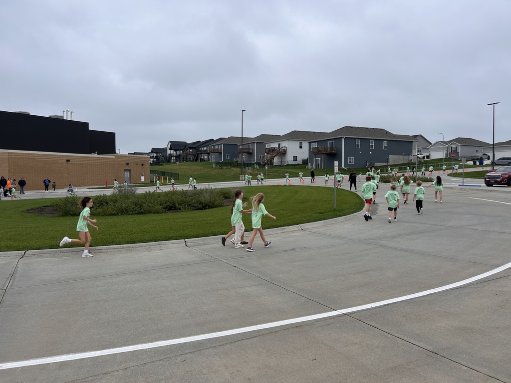 students running outside for a fun run in the parking lot