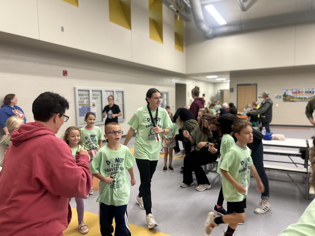 students running in the cafeteria for the fun run