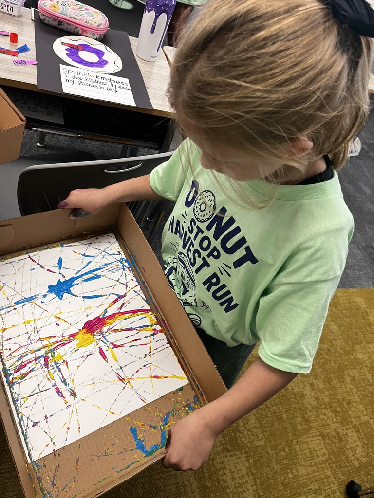 a student works on a painting project
