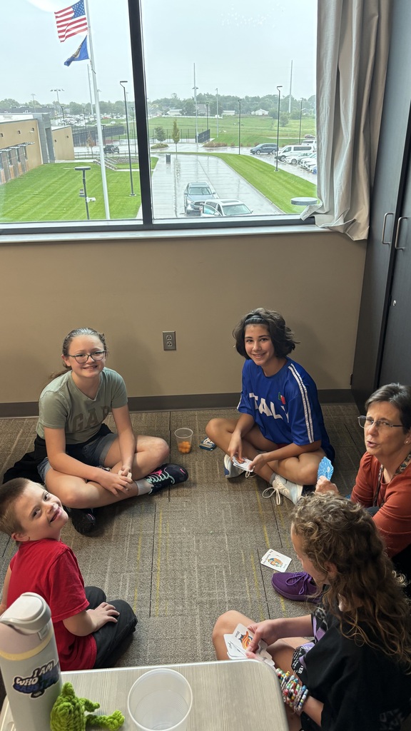 Students playing a card game at Unified Club