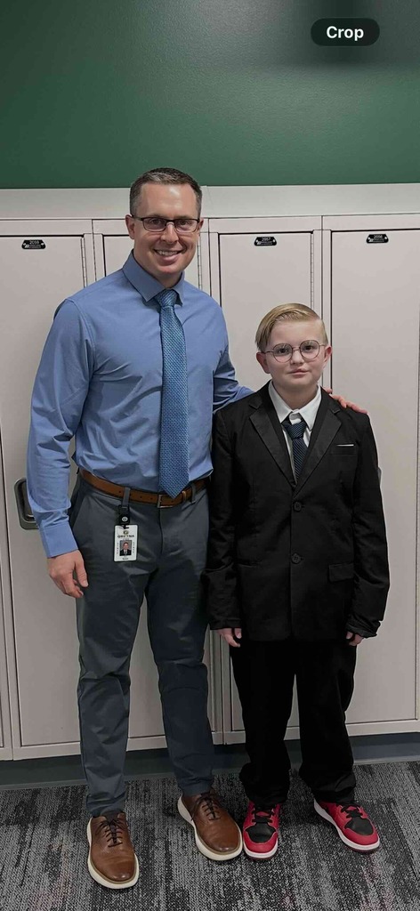 Mr. Gross stands with a student. 