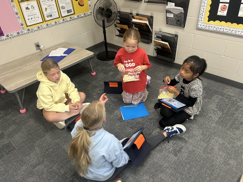 students talking in a circle in the classroom