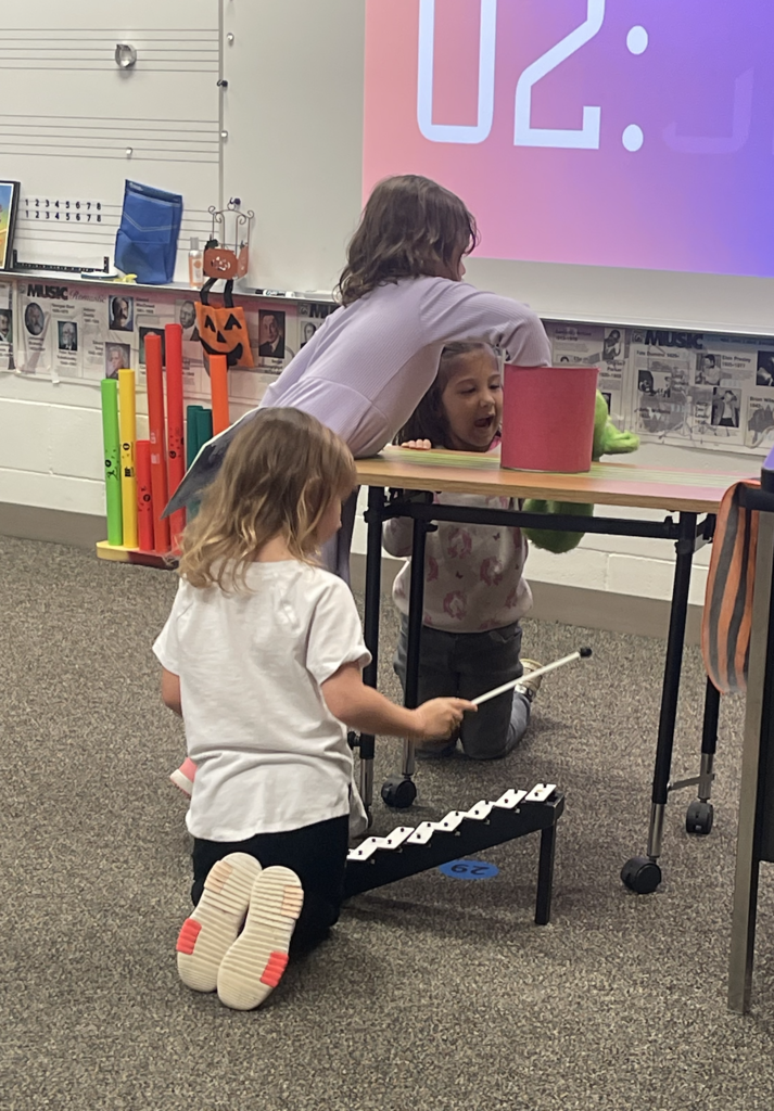 Students doing music stations