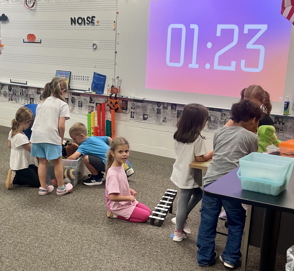 Students doing music stations