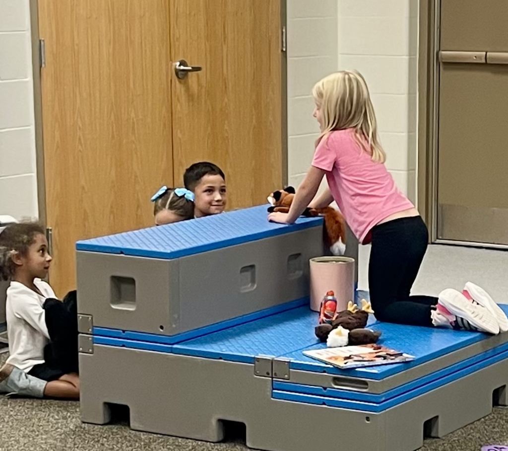 Students doing music stations