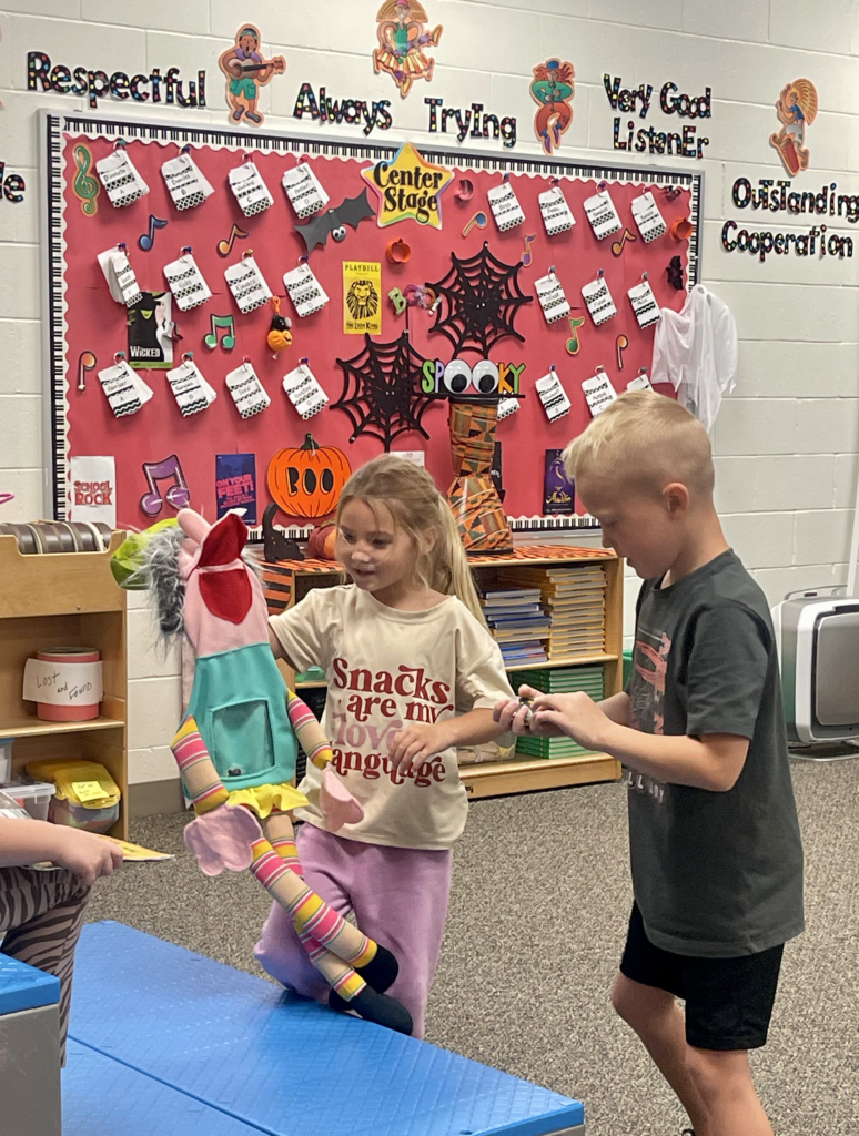 Students doing music stations