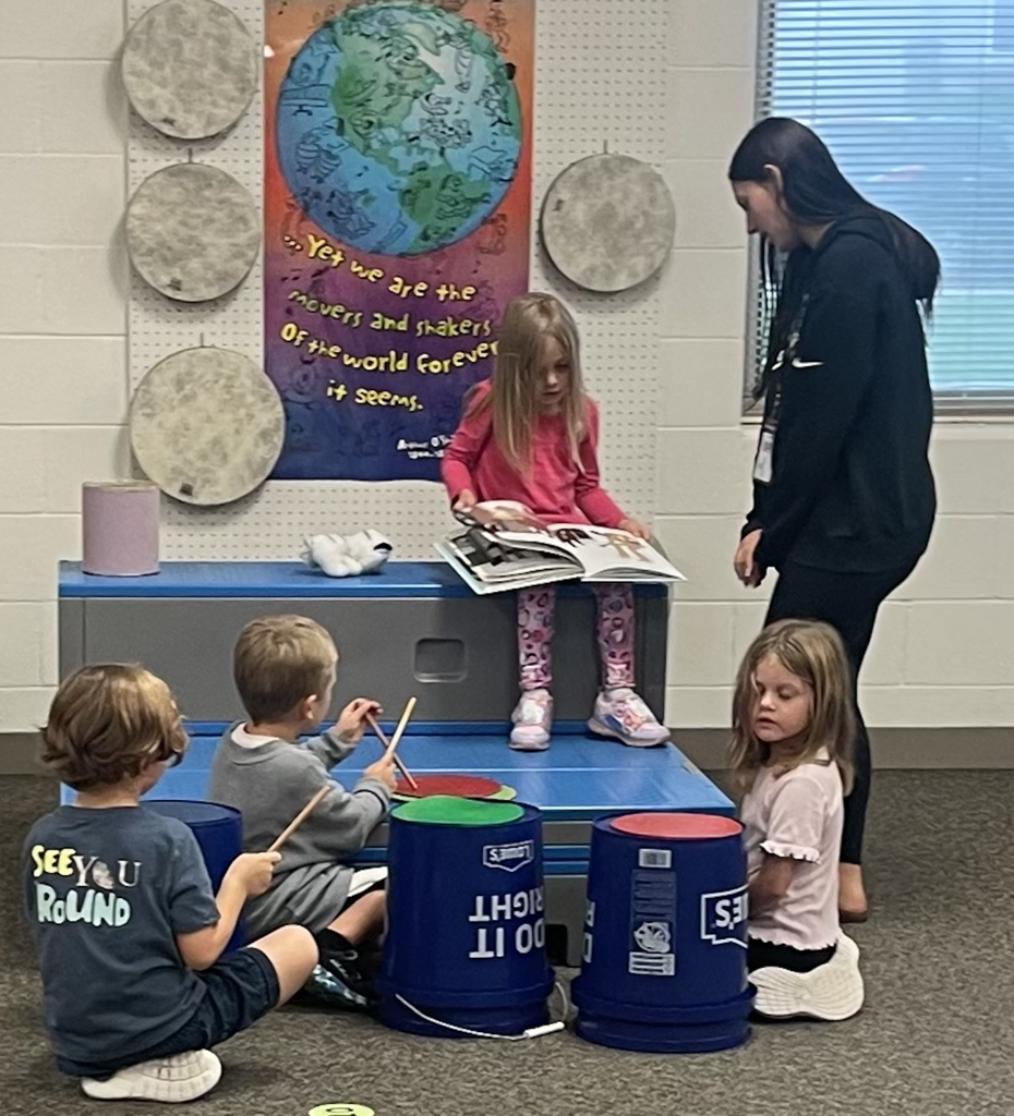 Students doing music stations