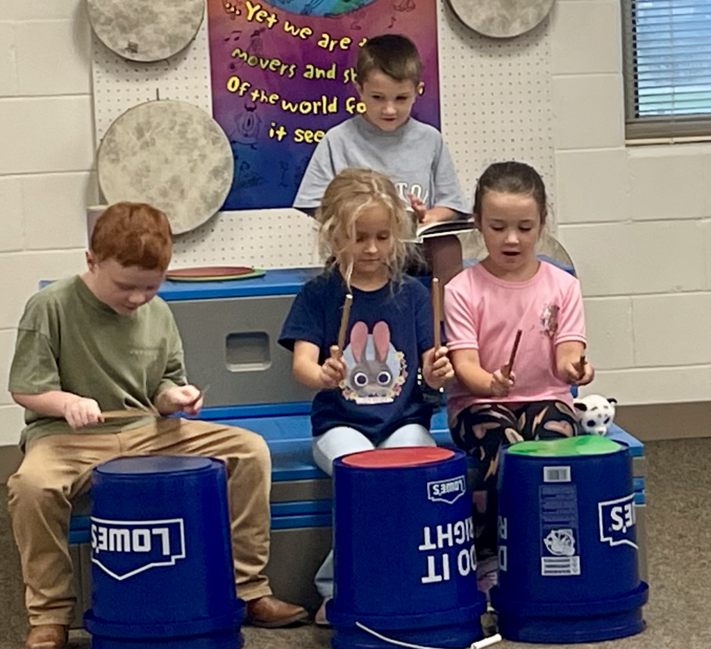 Students doing music stations
