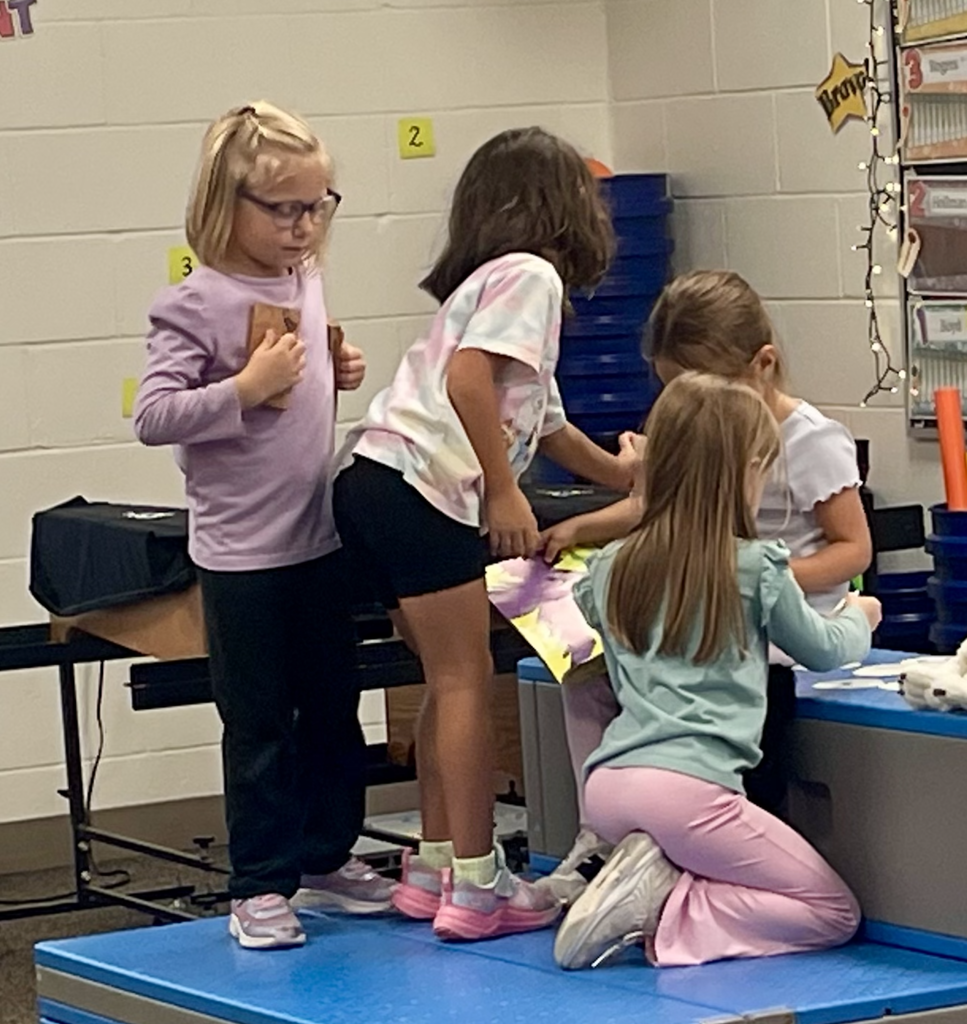 Students doing music stations