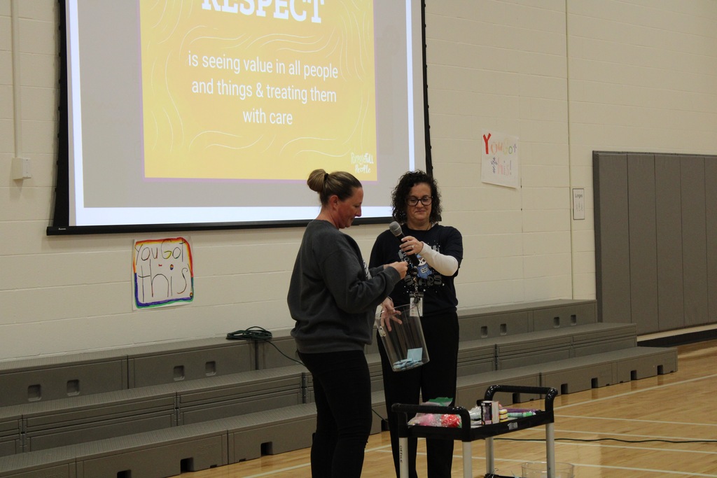 Mrs. Van Waart and Mrs. Gabriel draw a first grade winner.