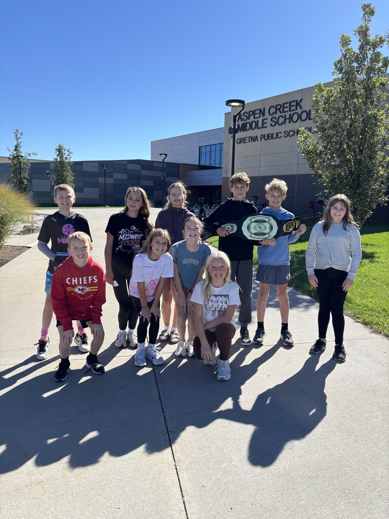 6th grade students outside ACMS celebrating Winning the Moment!
