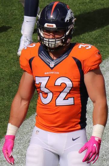 Andy Janovich wearing his #32 Denver Broncos jersey on the field.