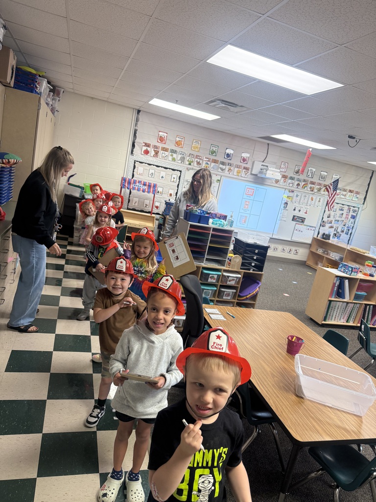 AM Preschool class lined up, smiling, and ready to walk around the school 