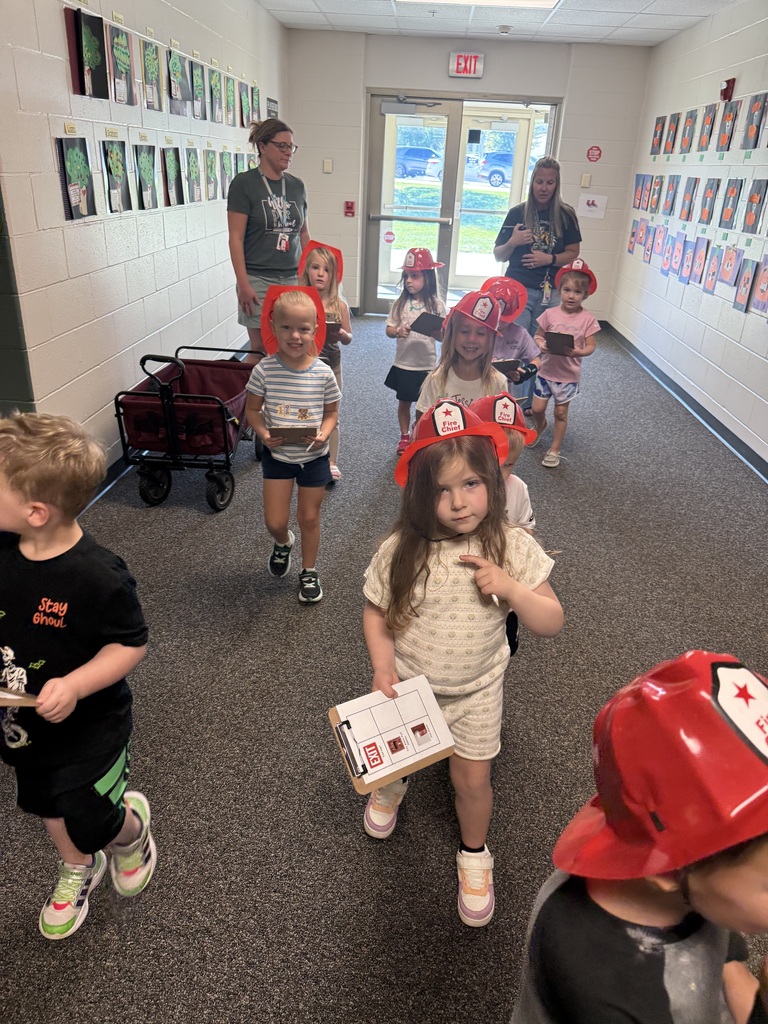 Students walking through the hall looking for fire alarms 