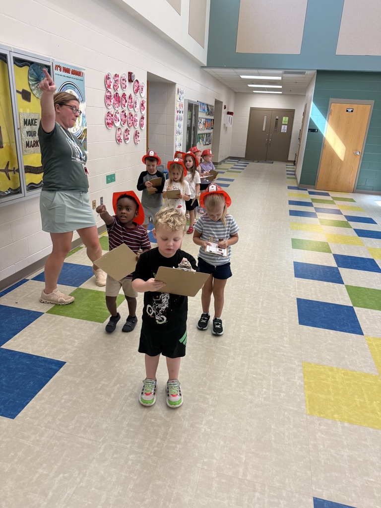 Students marking tallies on their clipboards 