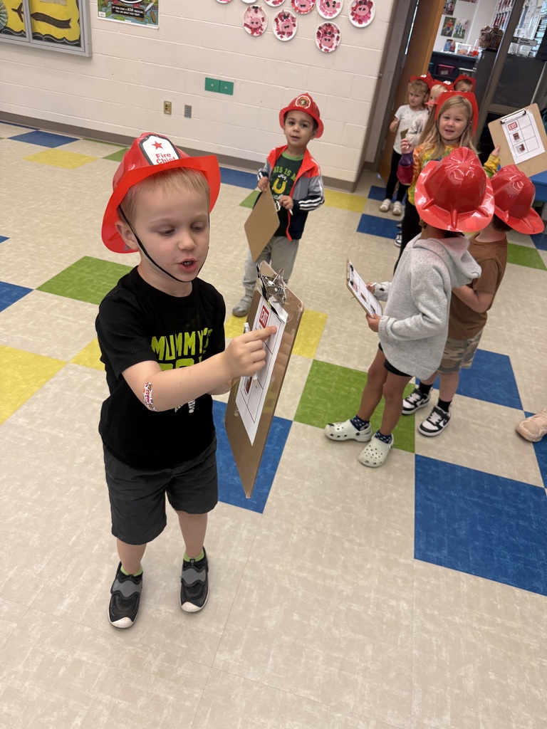 Student pointing at the exit sign on his clipboard