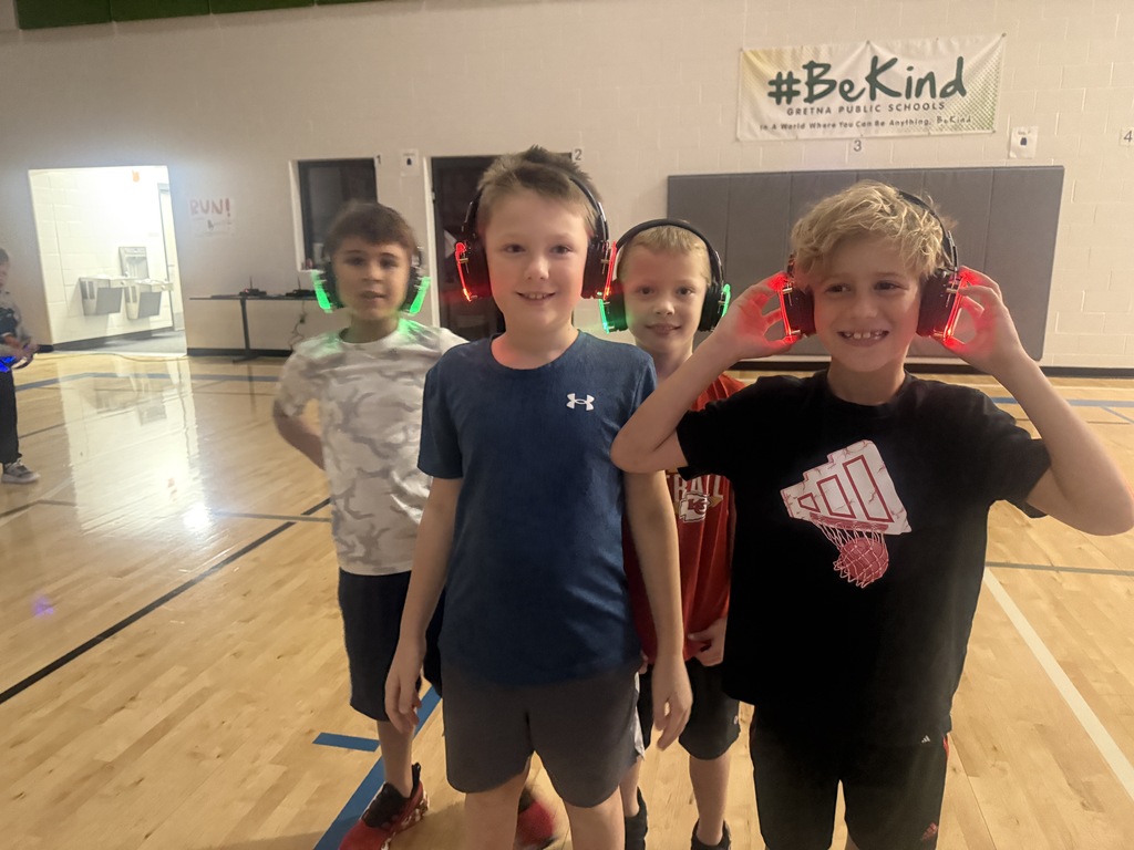 A group of 2nd grade boys pose with their headphones