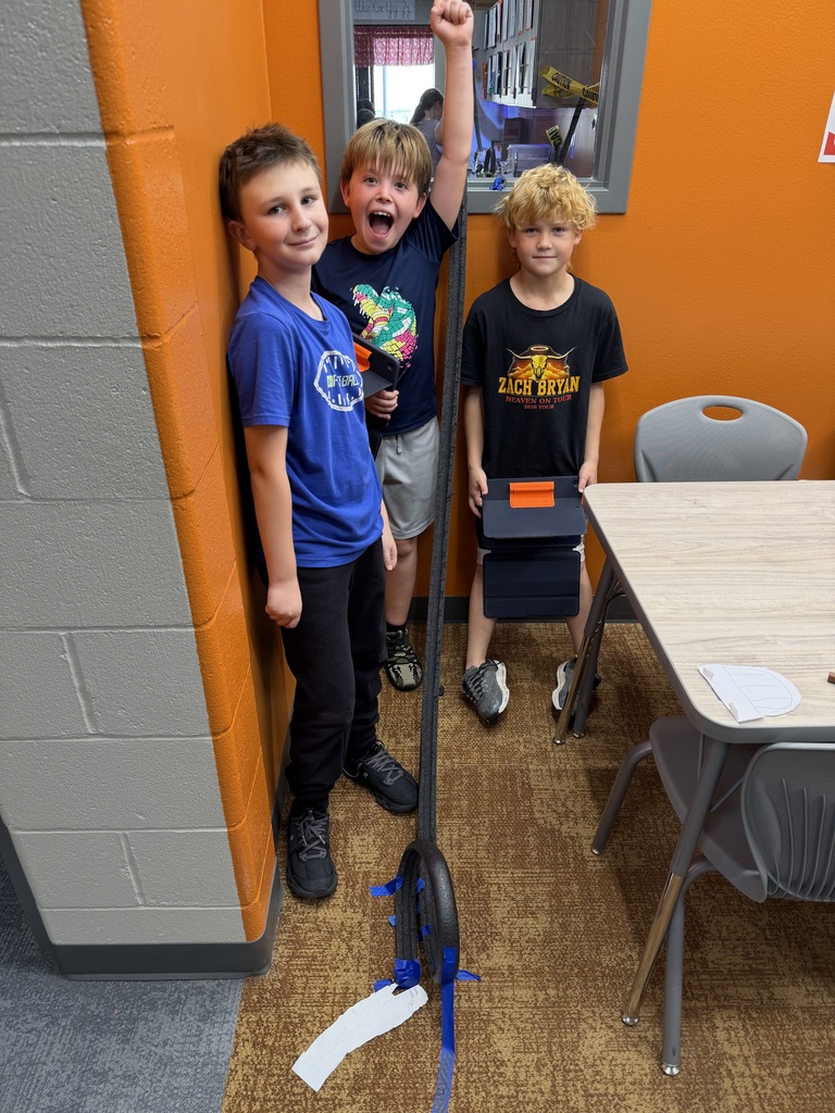 students working on a track in the hallway of a school