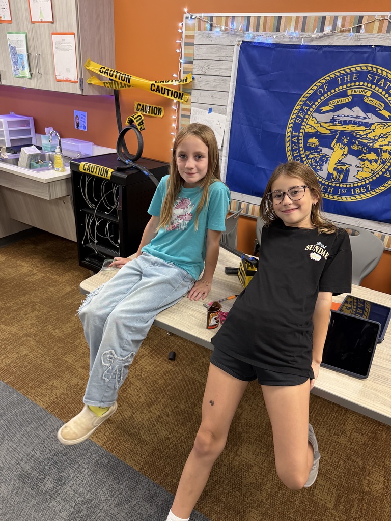 students working on a track in science class