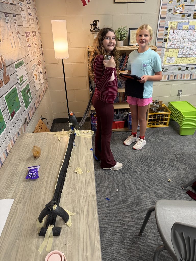 students work on a track in science class