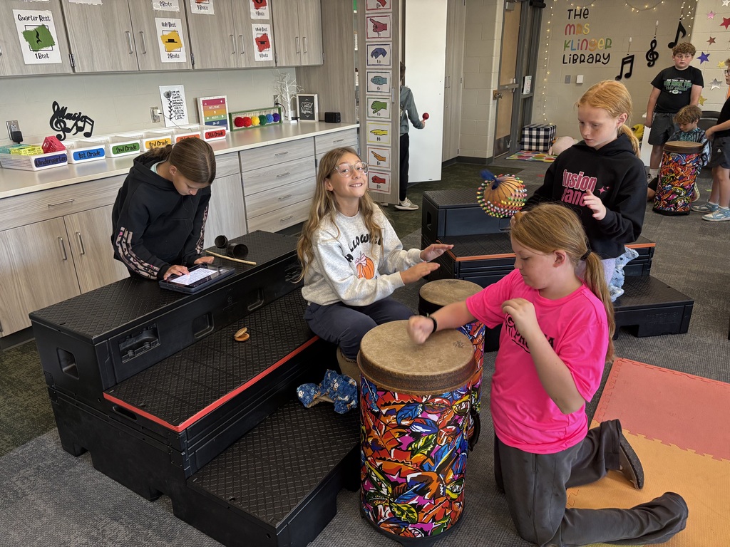 Students in Miss Beach's music class working hard on their drum ensembles