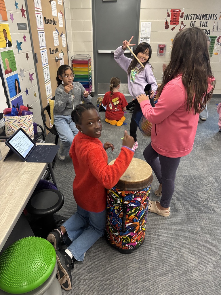 Students in Miss Beach's music class working hard on their drum ensembles
